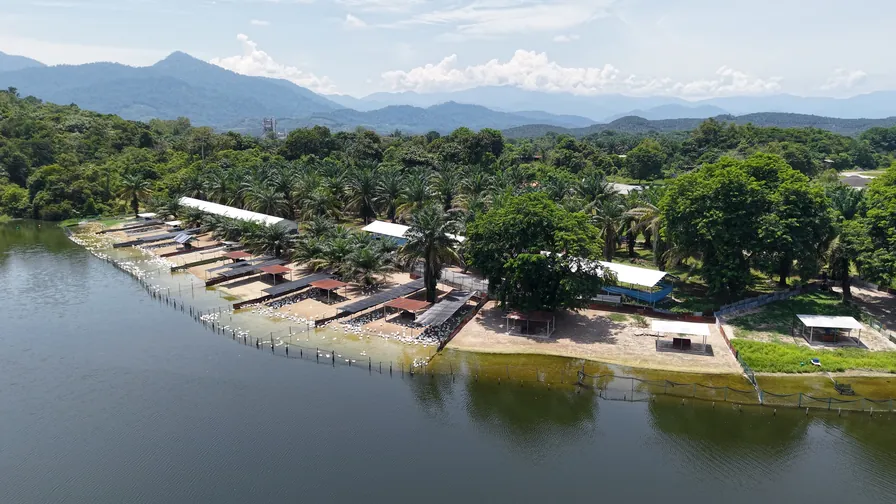 The farm seen from above, on the shore of its mountain-fed lake